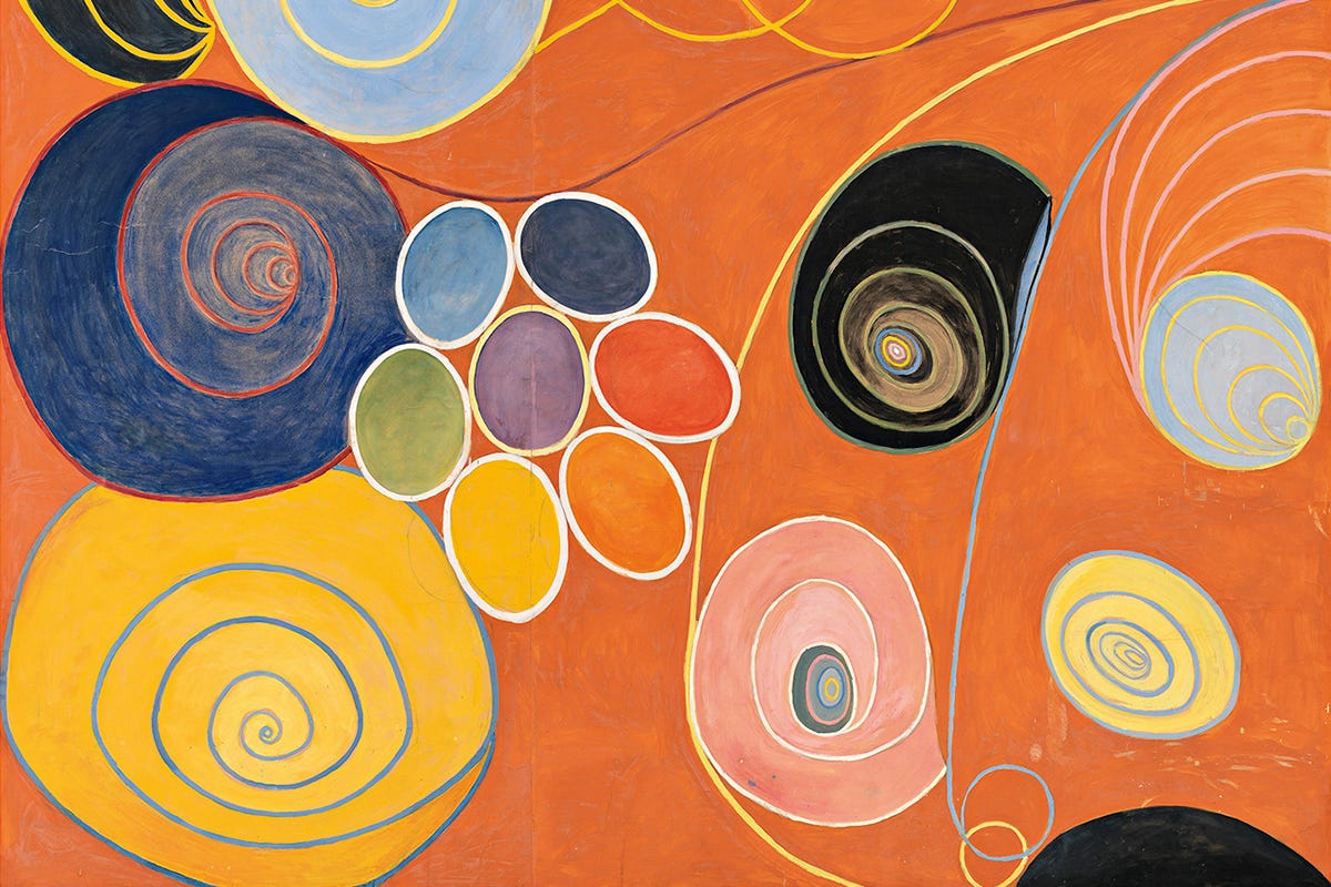 A large vertical painting filled with swirling pastel shapes, botanical forms, and looping handwritten text set against a warm orange background. Concentric circles, spirals, and seed‑like motifs float across the surface, arranged in loose clusters that suggest growth and movement. Pale blues, pinks, yellows, and whites contrast with the saturated ground. The composition is abstract and densely layered, with no central figure, spanning more than three meters in height. A large vertical painting filled with swirling pastel shapes, botanical forms, and looping handwritten text set against a warm orange background. Concentric circles, spirals, and seed‑like motifs float across the surface, arranged in loose clusters that suggest growth and movement. Pale blues, pinks, yellows, and whites contrast with the saturated ground. The composition is abstract and densely layered, with no central figure, spanning more than three meters in height.