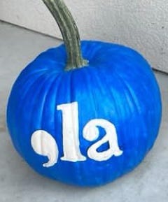 Tim Waltz and his black lab, Scout, Harris Walts signs, camo cap and banners, painted blue pumkin with ",la"