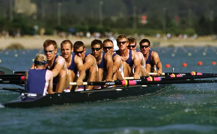 The Olympic rowing team, rowing in a boat