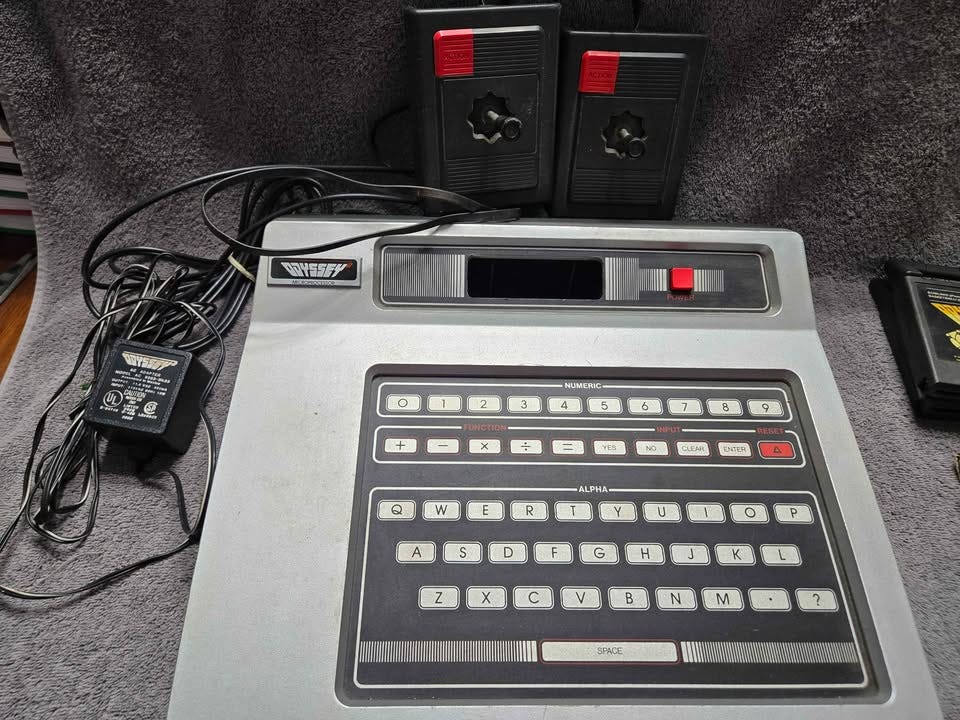 Product photo of Magnavox Odyssey 2, a second-generation home video game console released in North America in 1979. Product photo of Magnavox Odyssey 2, a second-generation home video game console released in North America in 1979.
