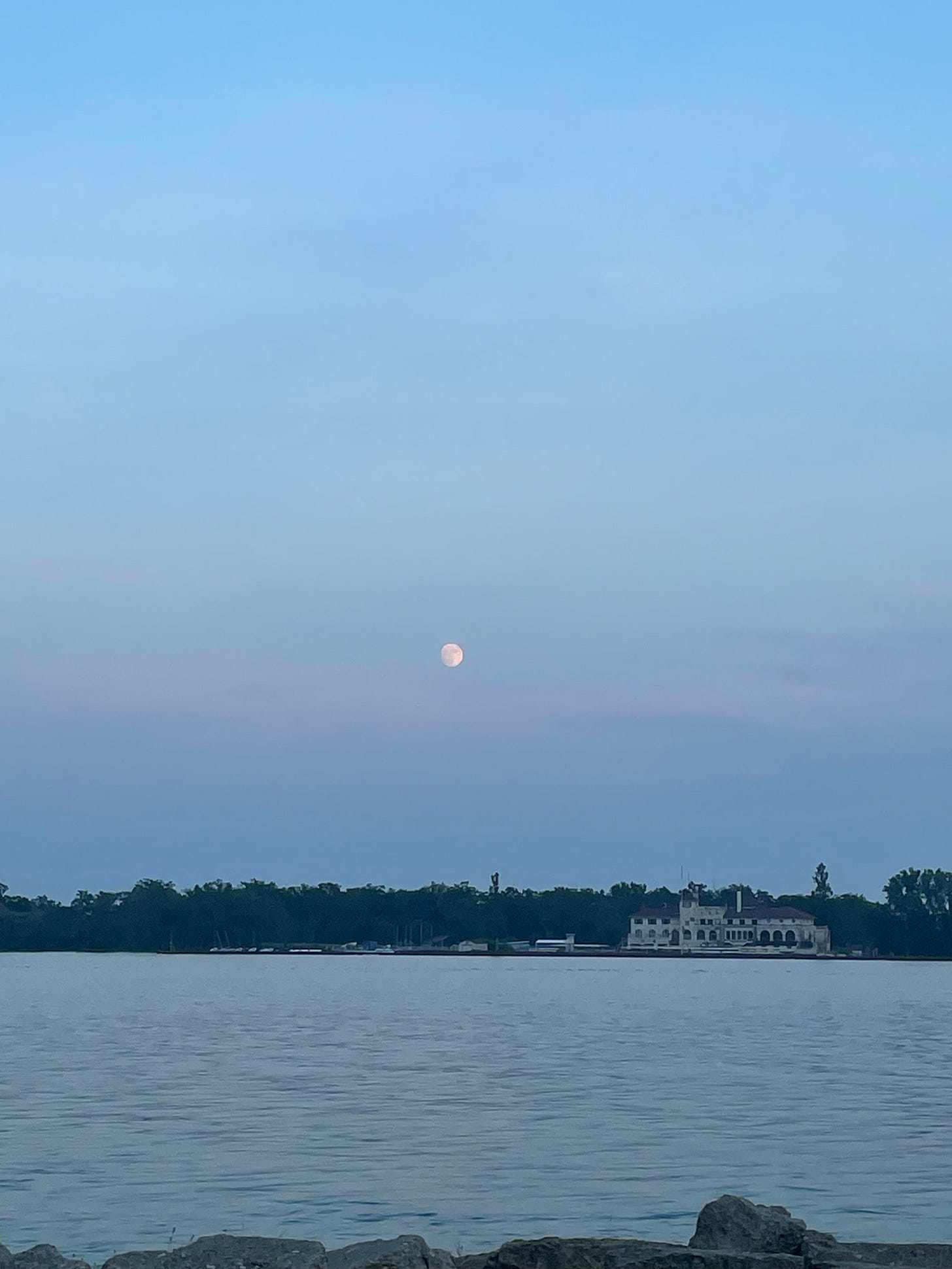 full moon above the detroit rivr, blue sky, gazing over the fake border full moon above the detroit rivr, blue sky, gazing over the fake border