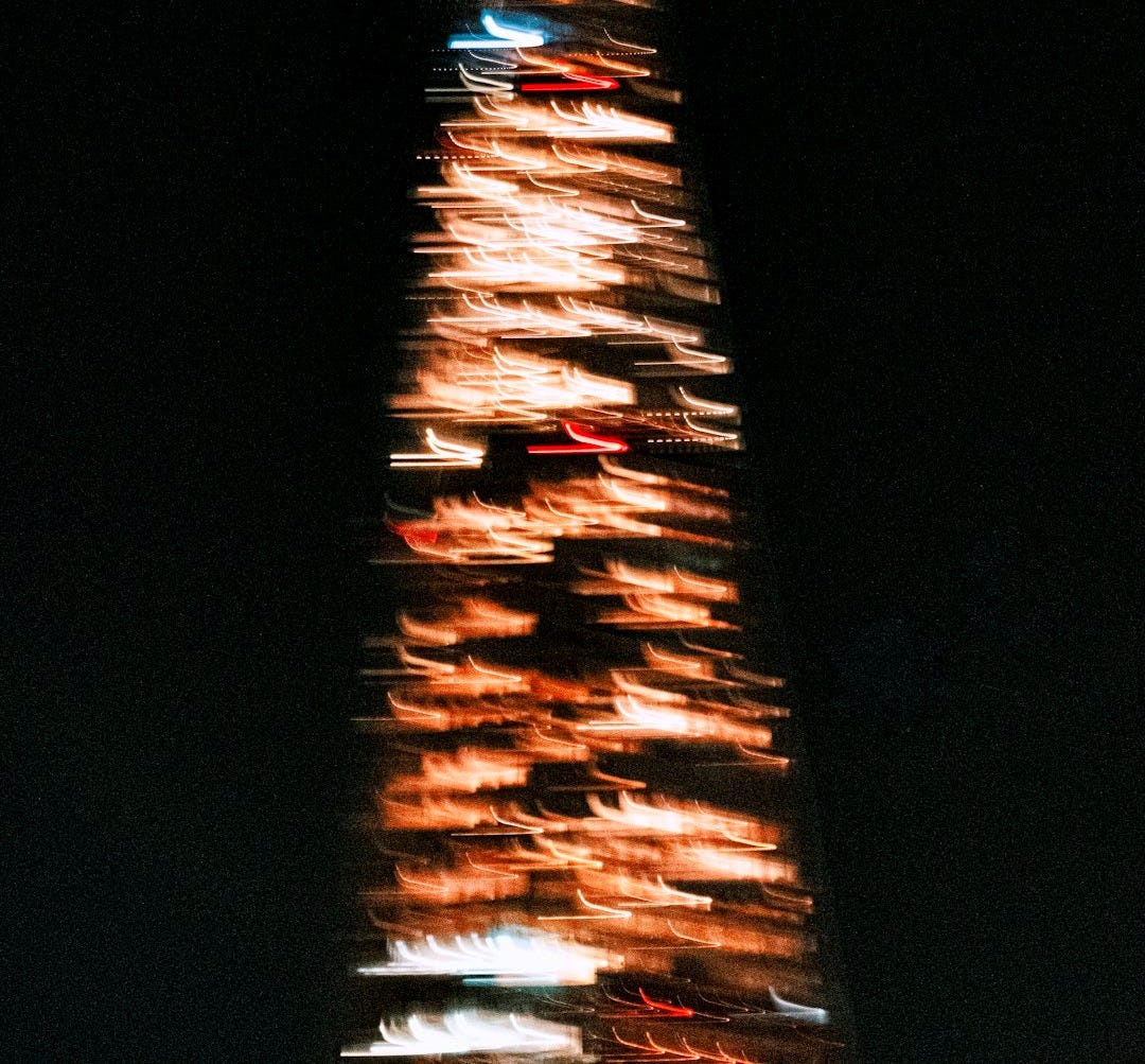 a tall building with lights a tall building with lights