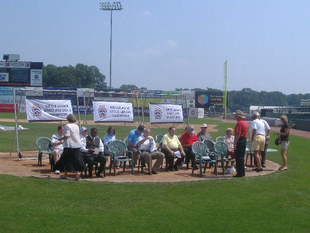 The politicians sit down so the event could get underway. The politicians sit down so the event could get underway.