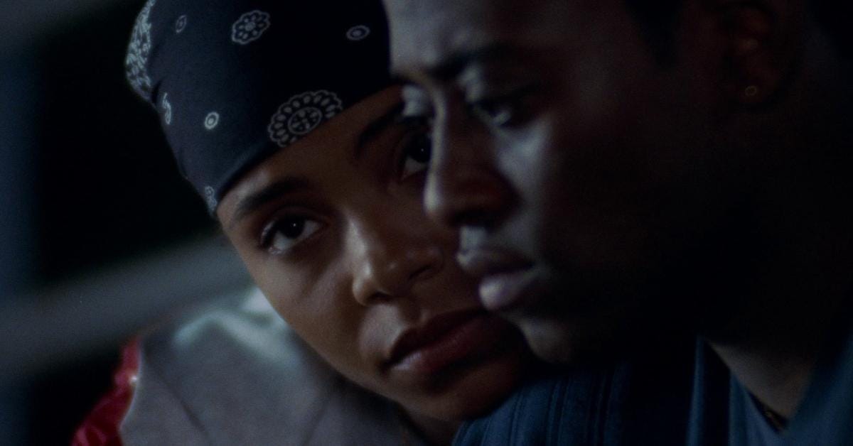 Sanaa Lathan as Monica comforts Omar Epps as Q on the bleachers