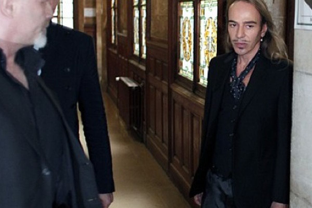 A person in a suit walking down a hallway

AI-generated content may be incorrect.