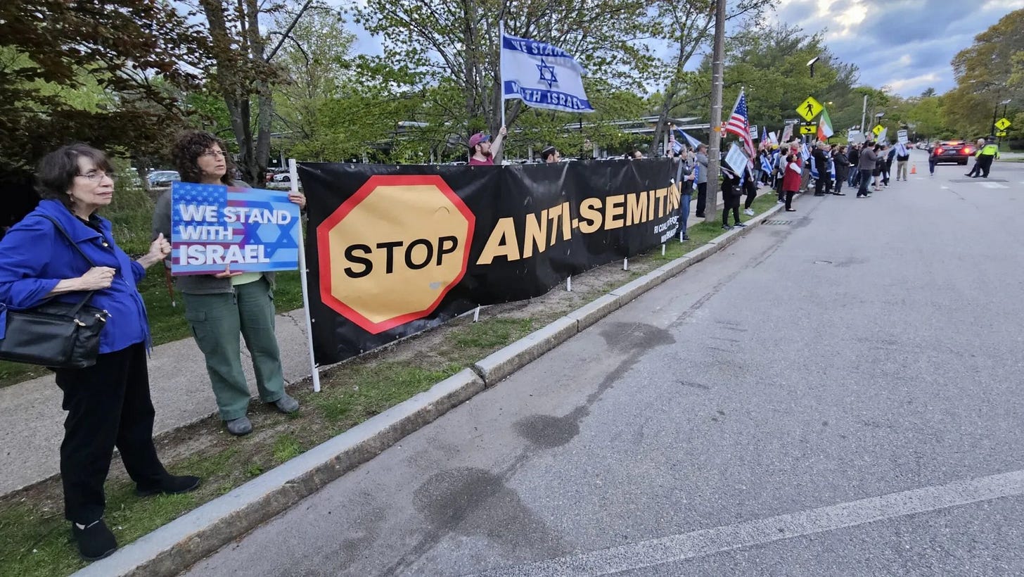 Pro-Israel/Anti-Palestinian protesters lined along a street