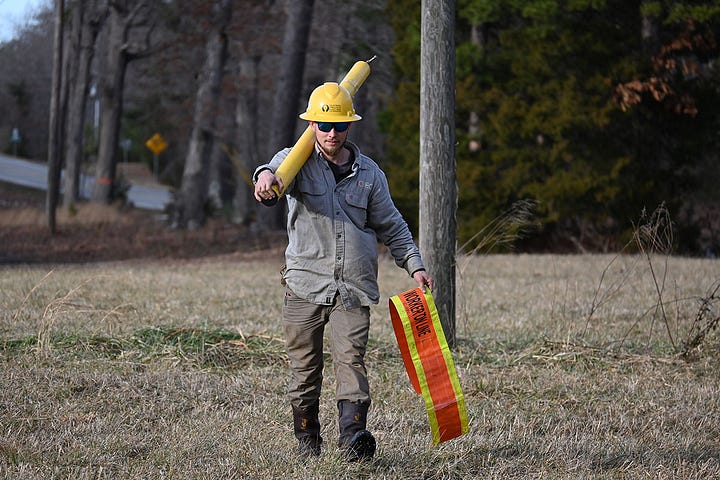 (image) Graham Hughes and Mike Reynolds, two linemen with the Central Virginia Electric Cooperative (Credit CVEC)