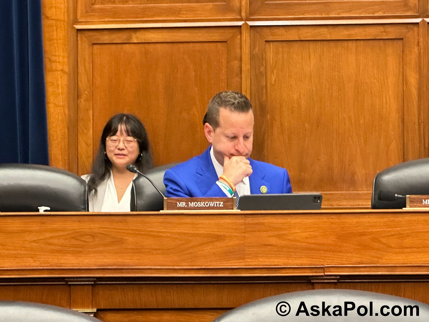 Politican in suit reads from dais. Photo: Matt Laslo © www.askapol.com