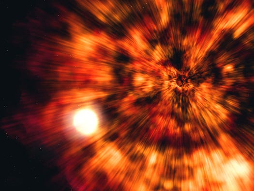 An artist's illustration showing the effects of the collapse and supernova explosion of a massive star.