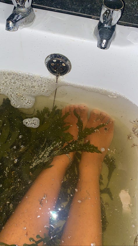 image one is my feet soaking in a tub filled with kelp. Image two is a beautiful Celtic fireplace fueled by peat moss. Image three is a woman standing joyfully along the cliffs on Cleggan