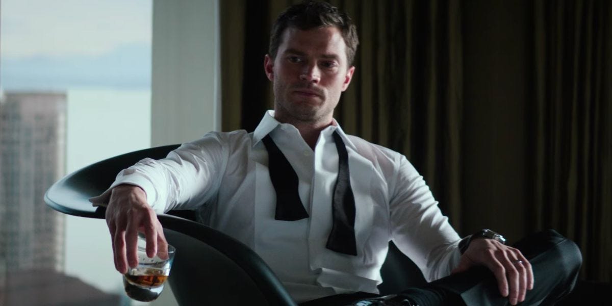 Cristian Grey, drinking some whiskey, refusing to reflect on anything