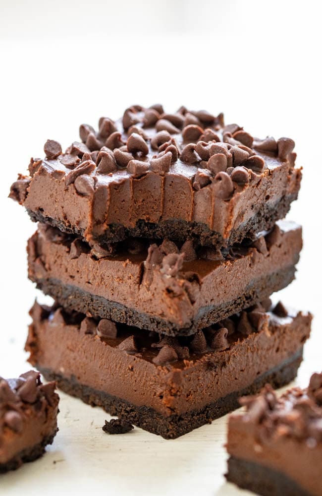 Death by Chocolate No-Bake Cheesecake Bars — Only for serious chocoholics because they're rich, creamy, decadent, and loaded with chocolate!! NO-BAKE and an easy MAKE-AHEAD dessert!! Death by Chocolate No-Bake Cheesecake Bars — Only for serious chocoholics because they're rich, creamy, decadent, and loaded with chocolate!! NO-BAKE and an easy MAKE-AHEAD dessert!!
