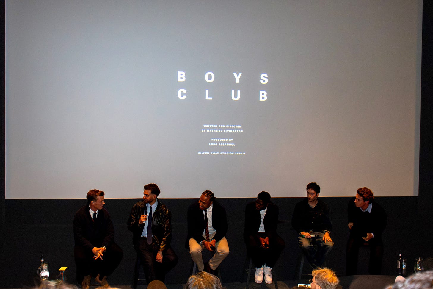 The Boys Club cast and crew sit on stage during a Q&A with audience members following the screening. The Boys Club cast and crew sit on stage during a Q&A with audience members following the screening.