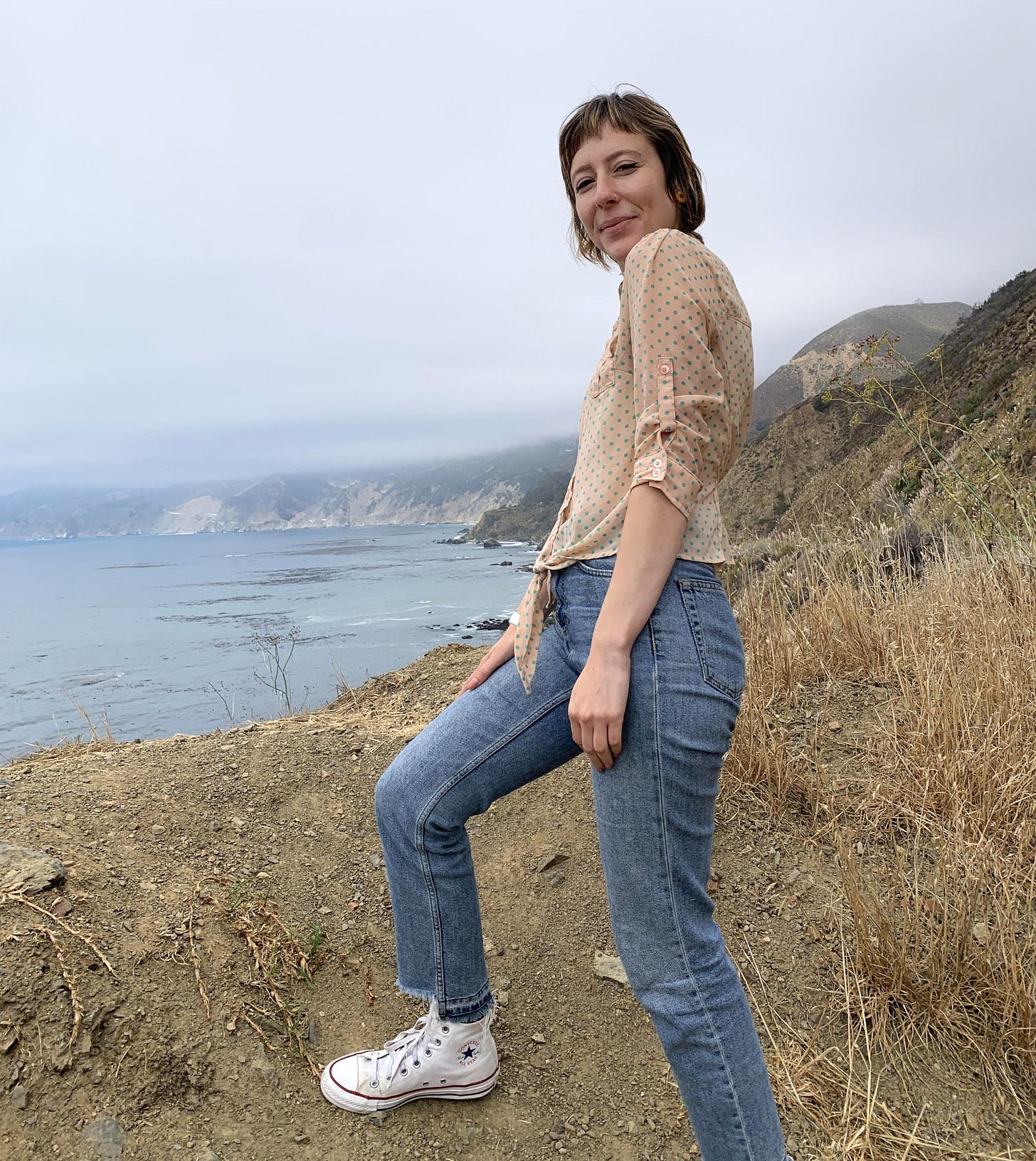 Me in a polka dot shirt, jeans, and Converse overlooking the Pacific Ocean in Big Sur Me in a polka dot shirt, jeans, and Converse overlooking the Pacific Ocean in Big Sur