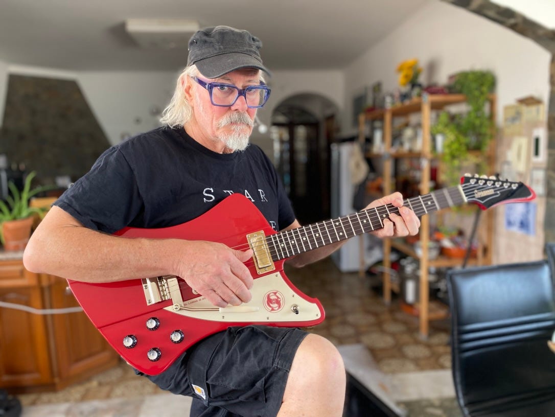 Simon Campbell with his new custom Firehawk guitar from Springer Guitars, France