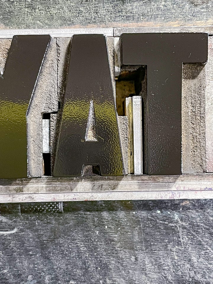 Two photos from the making of the poster that show how the type is set on press and how it looks when printed