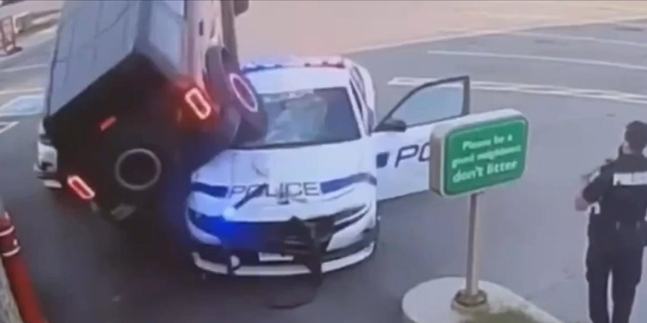 WATCH: Drive-thru surveillance video shows a suspect in a stolen vehicle attempting to evade police by driving over a police cruiser in Mississauga, Ontario, yesterday