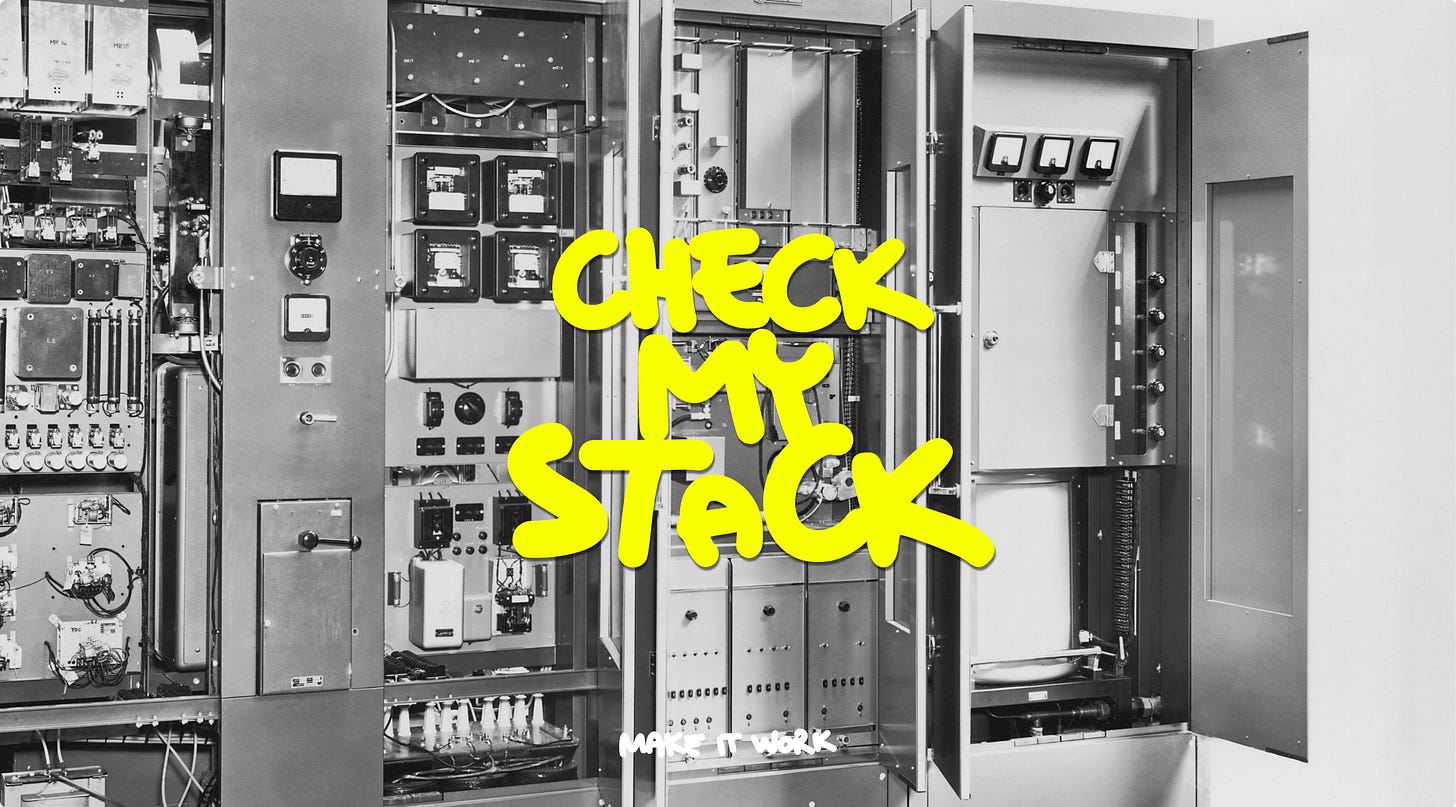 Open industrial electrical panel with yellow graffiti-style text 'Check my stack' and 'Make it work' caption. Open industrial electrical panel with yellow graffiti-style text 'Check my stack' and 'Make it work' caption.