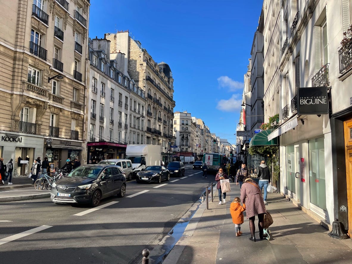typical street in Paris, bus lane on the right typical street in Paris, bus lane on the right