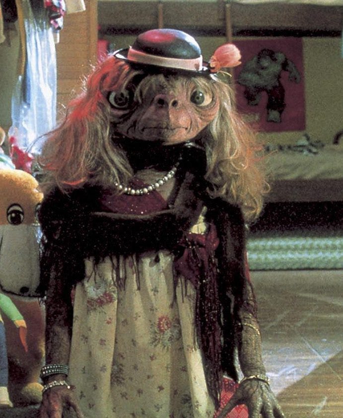 In E.T (1982), E.T is seen wearing a wig and lady clothes. A ...