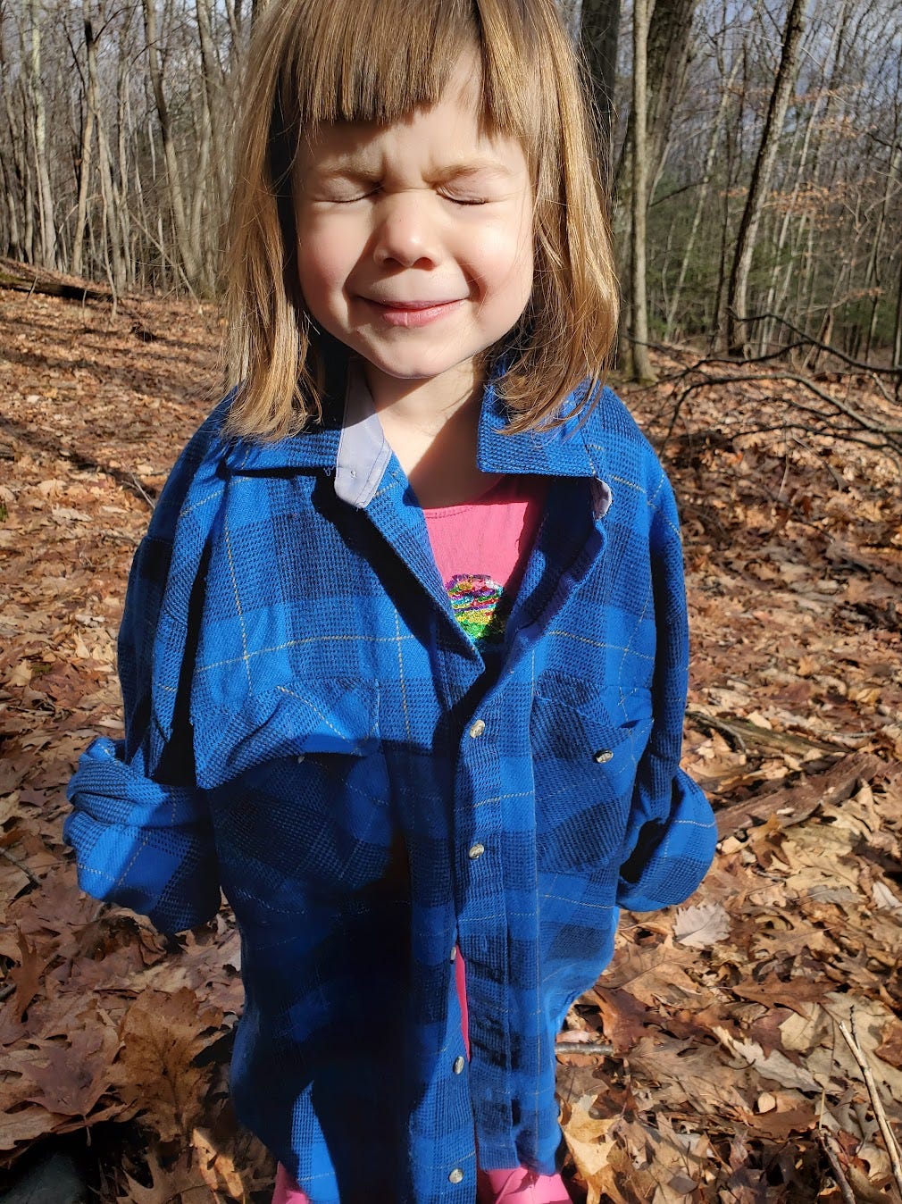 little white girl in plaid shirt is unhappy