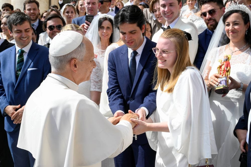 Pope Leo XIV greets a newlywed couple in St. Peter’s Square Pope Leo XIV greets a newlywed couple in St. Peter’s Square