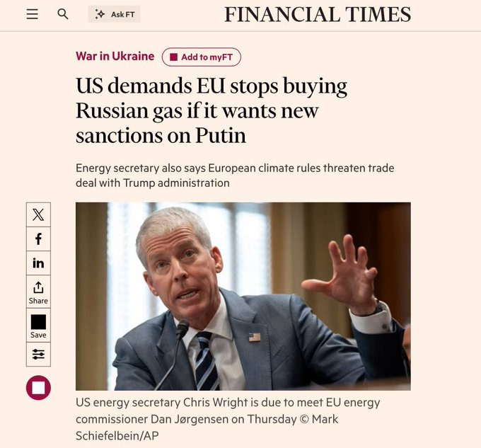 Chris Wright, a man in a suit and tie, gesturing with his hand raised. The background shows a blurred indoor setting with light coming through windows.