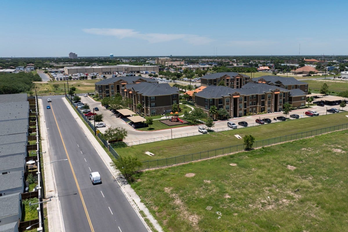 An aerial view of an apartment complex next to commercially zoned land for sale in McAllen on May 12, 2025.