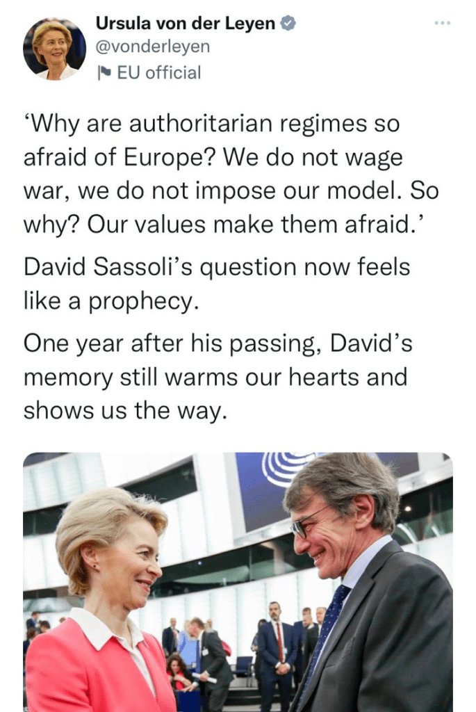 Two people talking Description automatically generated with medium confidence