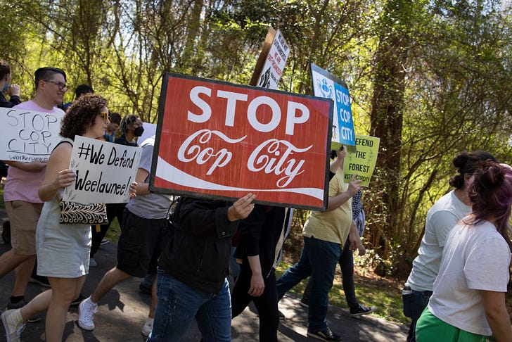 Environmental activists hold a rally and a march through the Atlanta Forest, a preserved forest Atlanta that is scheduled to be developed as a police training center on March 4, 2023 (Photo by Andrew Lichtenstein/Corbis via Getty Images)