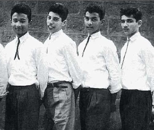 A group of boys in white shirts

Description automatically generated