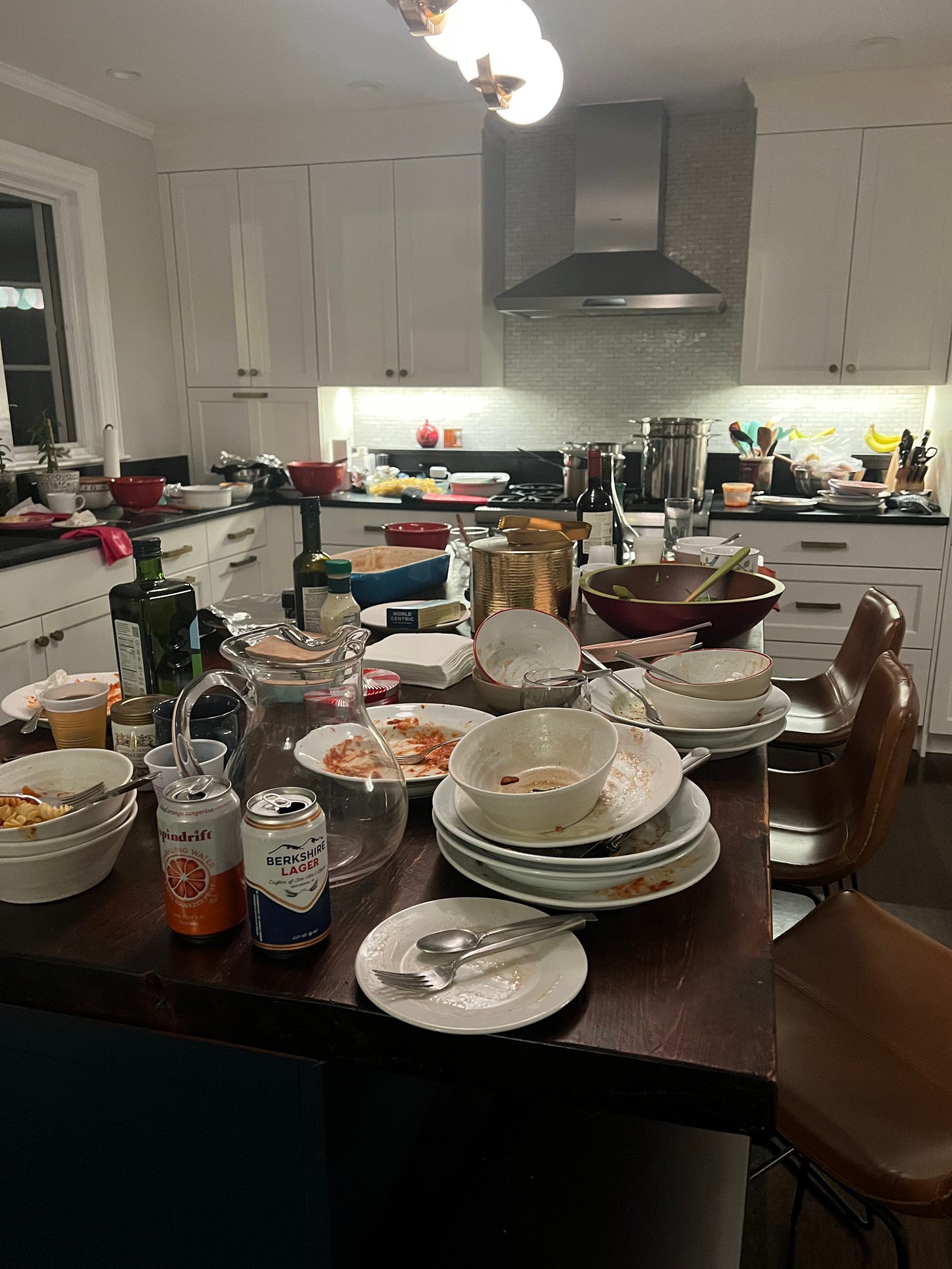 a kitchen stacked with dirty dishes