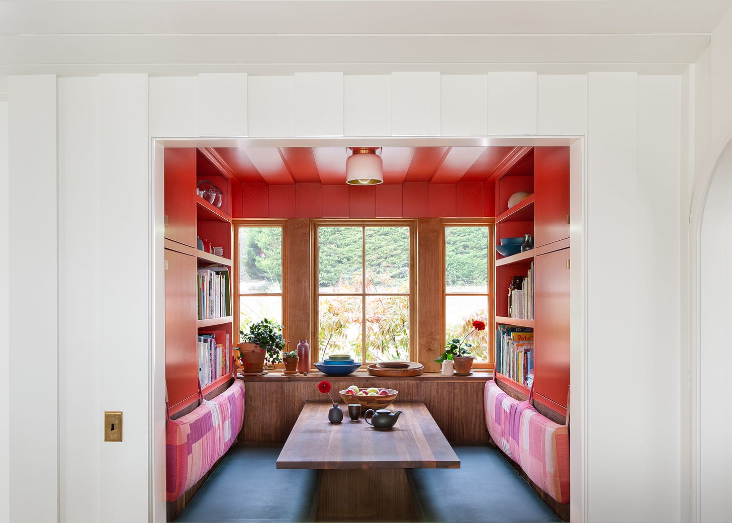 Breakfast nook with windows and built-in storage