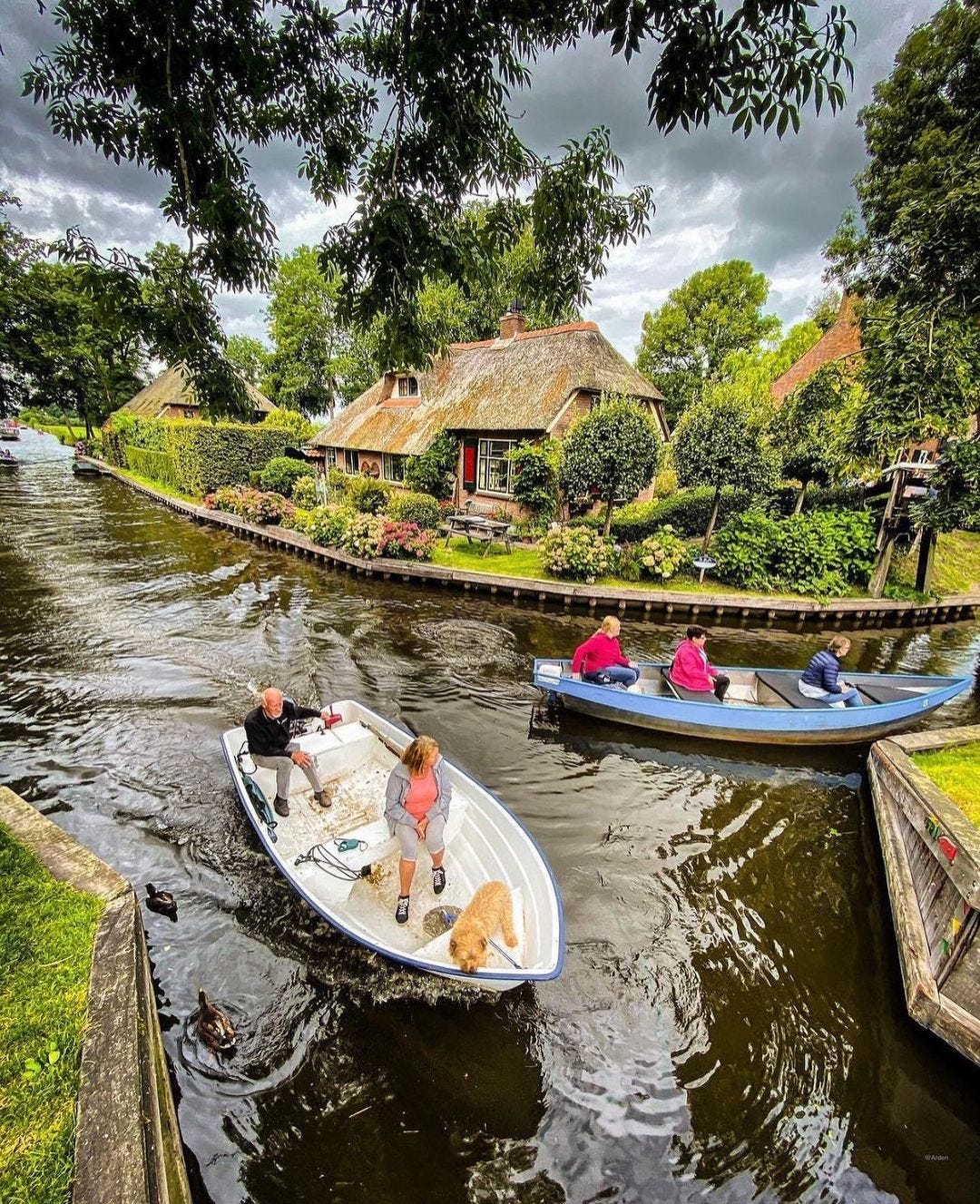 May be an image of 5 people, riverboat, boathouse and houseboat