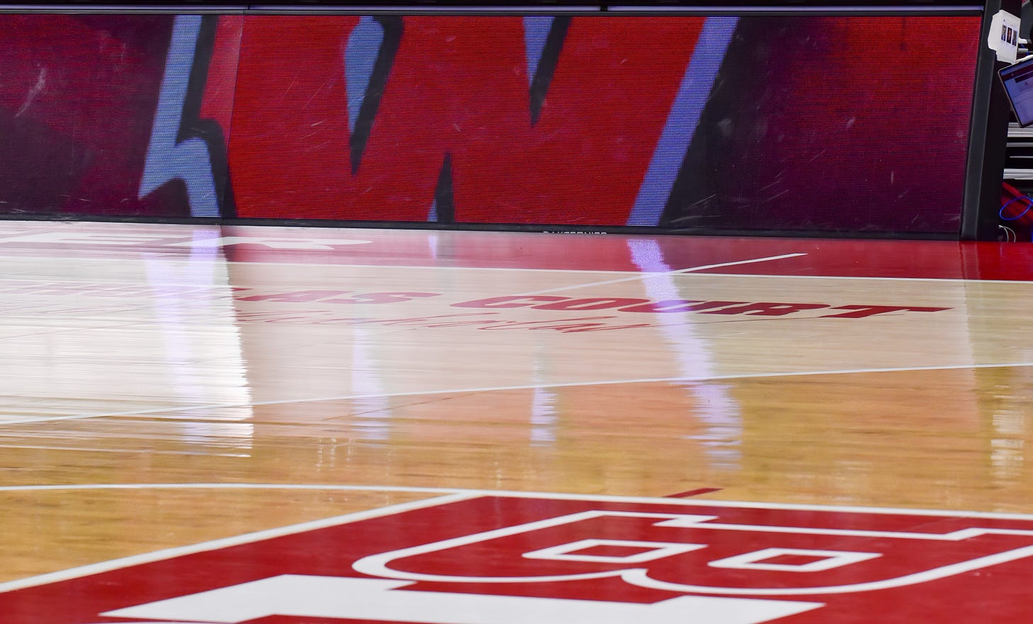 Wide view of the Wisconsin Badgers basketball court inside the Kohl Center before game action. Photo credit: Aaron Frey.