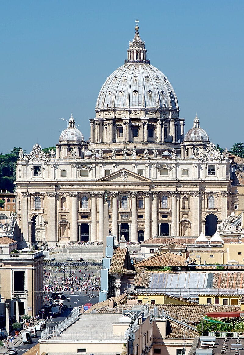 Photo. The façade is wide and has a row of huge columns rising from the basement to support the cornice. The ribbed, ovoid dome is surmounted by a lantern topped with ball and cross. Its drum is framed by two very much smaller domes. Photo. The façade is wide and has a row of huge columns rising from the basement to support the cornice. The ribbed, ovoid dome is surmounted by a lantern topped with ball and cross. Its drum is framed by two very much smaller domes.