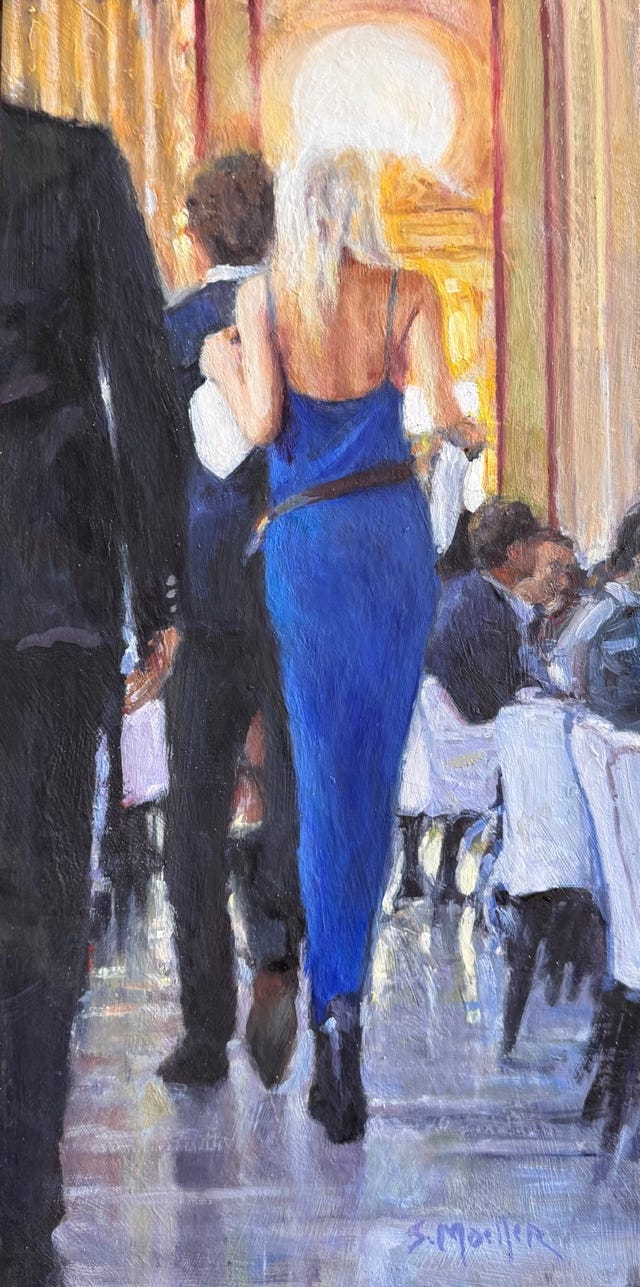 A person in a blue dress

Description automatically generated