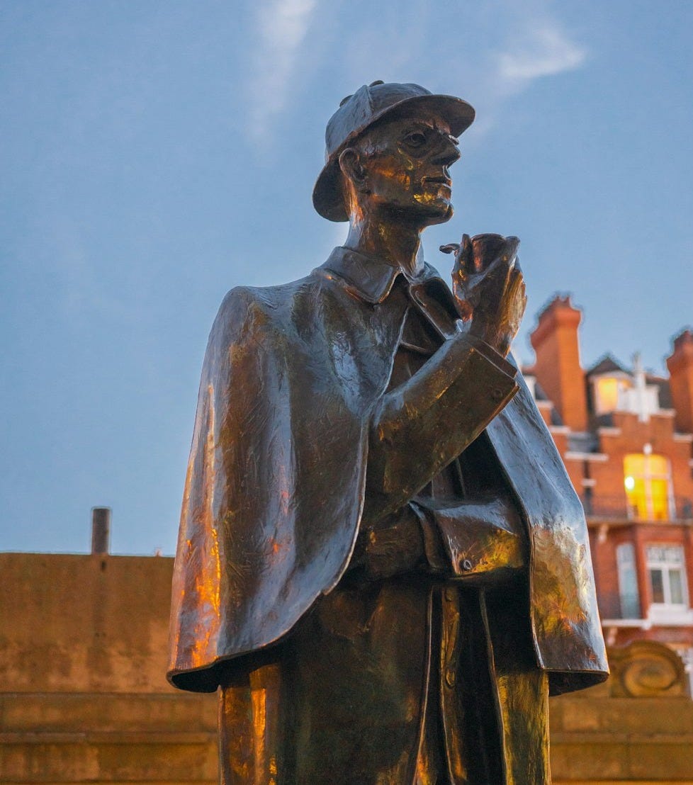 A statue of a man holding a pipe