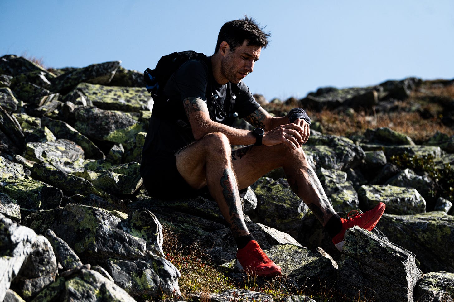 The author sitting on a stone in the mountains The author sitting on a stone in the mountains