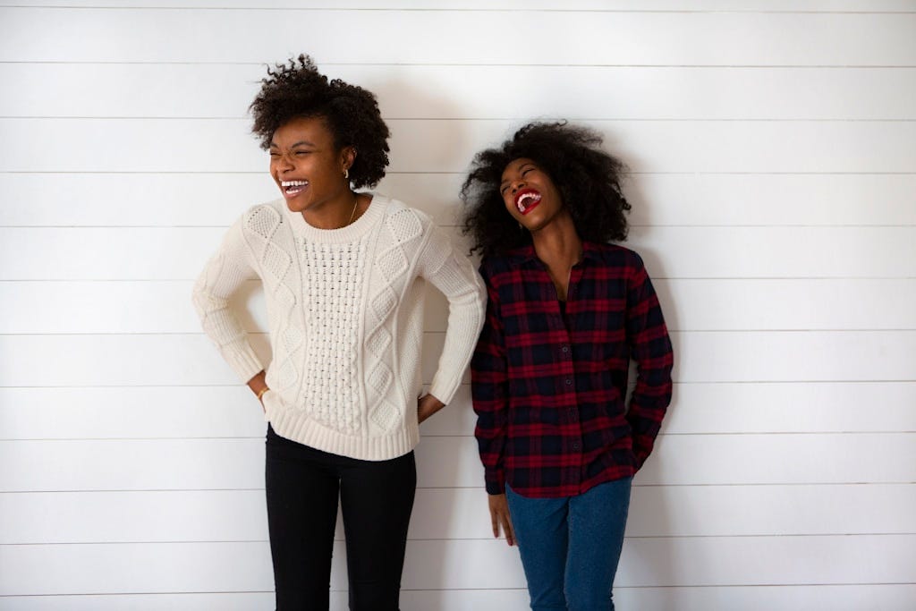two woman smiling two woman smiling