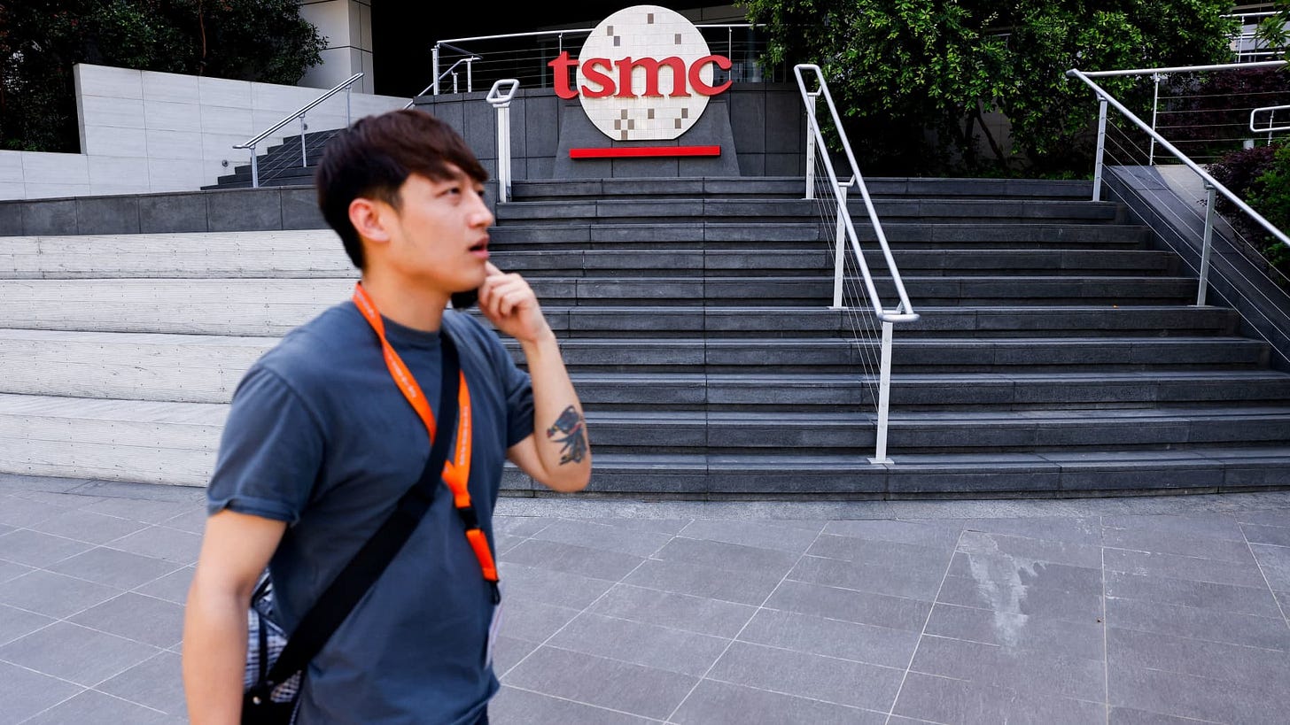 A man walks past a TSMC logo at Hsinchu Science Park in Hsinchu, Taiwan April 15, 2025. REUTER/Ann Wang