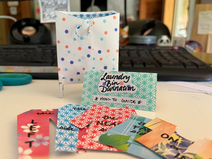 Two images: 1, a close-up of a tiny, colorful paper laundry basket, a little booklet that says "Laundry Divination How-To Guide", and a spread of brightly colored paper-doll sized clothes, 2 :Devan and her ukulele by a window in a dark-paneled room, smiling as she plays