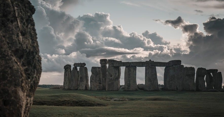 gray rock formation under white clouds during daytime