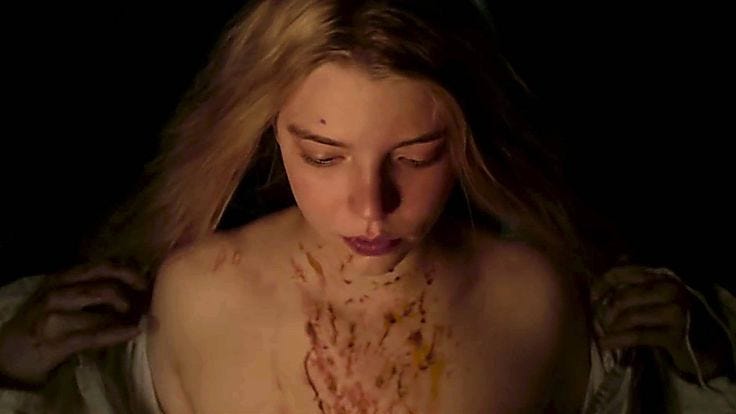 This may contain: a woman with blood all over her face and chest is looking down at the camera