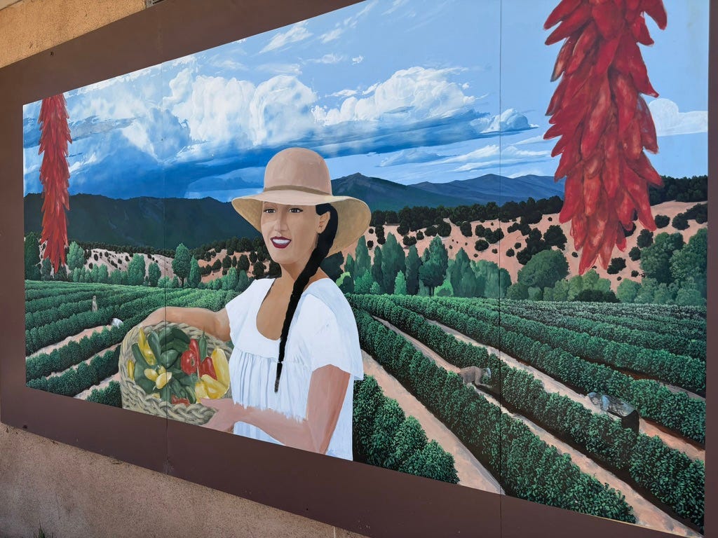 Mural of a woman in a field of vegetables