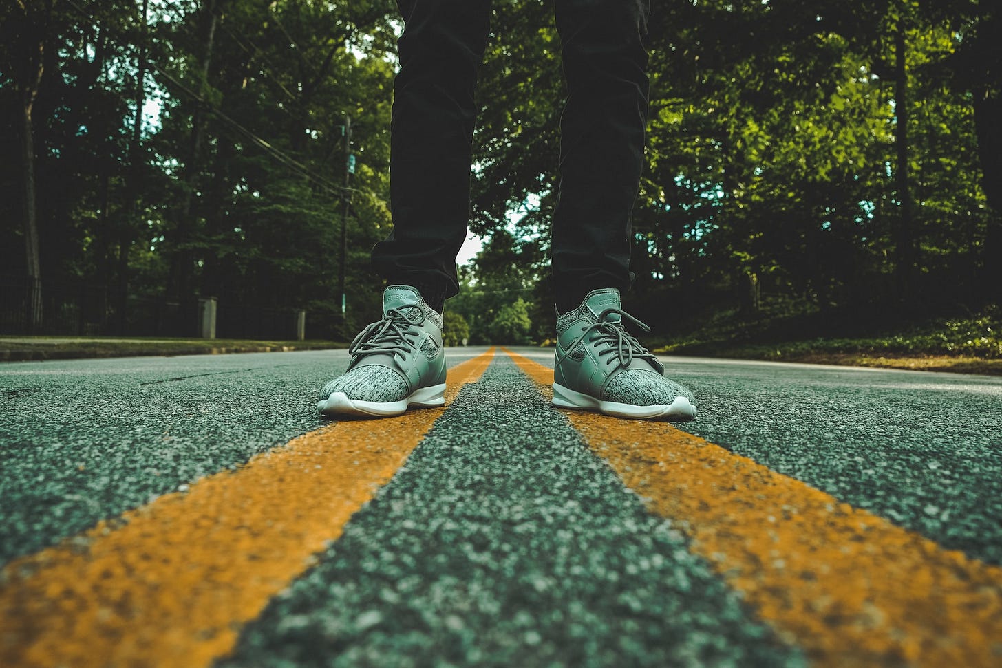 A person standing in the middle of a road A person standing in the middle of a road