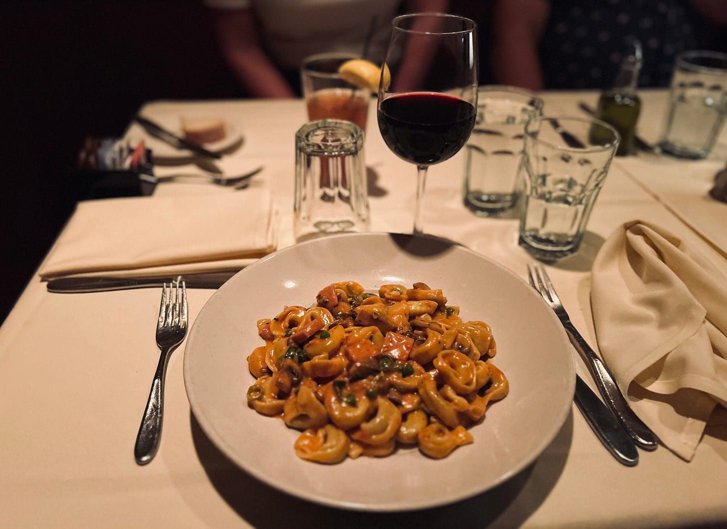 pasta, bowl, utensils, wine