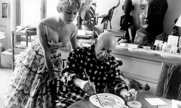 Brigitte Bardot watching Picasso paint.