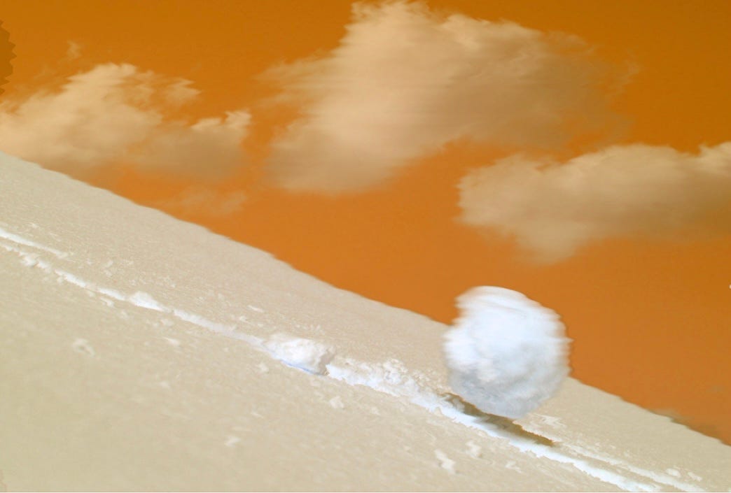 Snowball rolling down hill