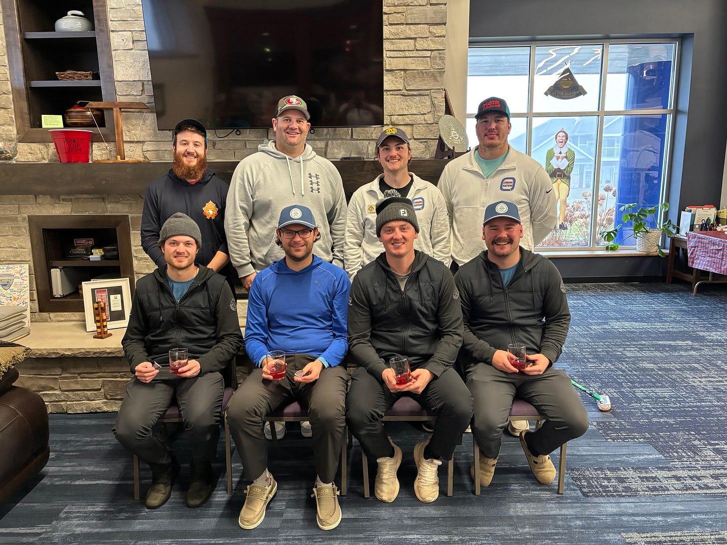 May be an image of 8 people, people golfing and text
